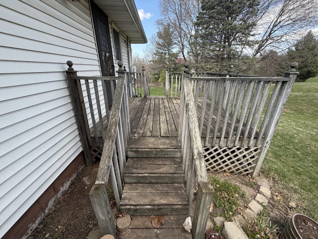 Before image of weathered wood deck in Peoria, IL before restoration by River City Pressure Washing