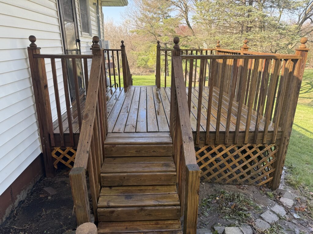 After image of restored wood deck in Peoria, IL following professional cleaning, stripping, and staining by River City Pressure Washing