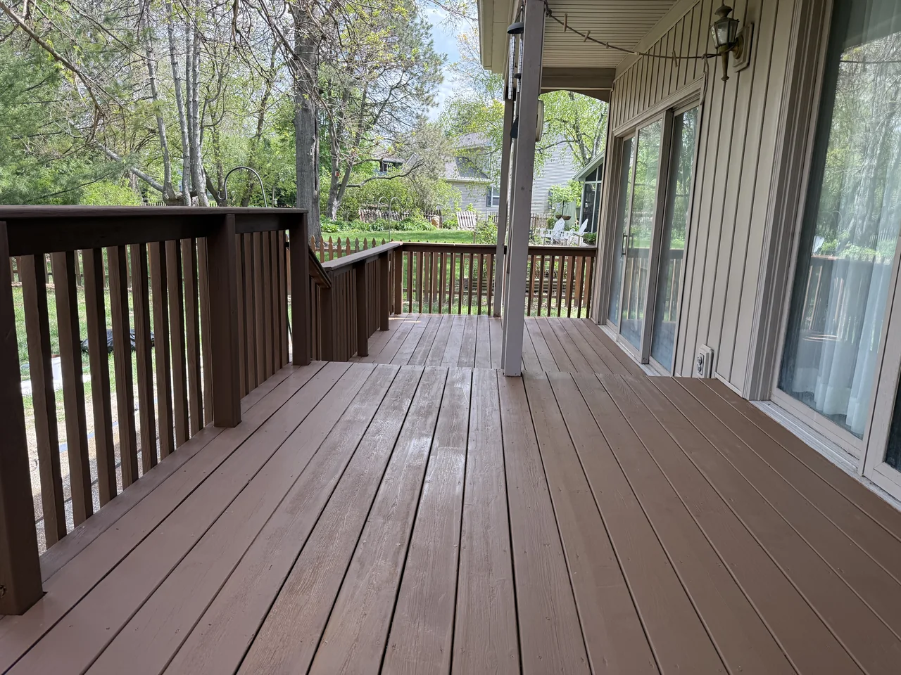 Covered wood deck after restoration by River City Pressure Washing