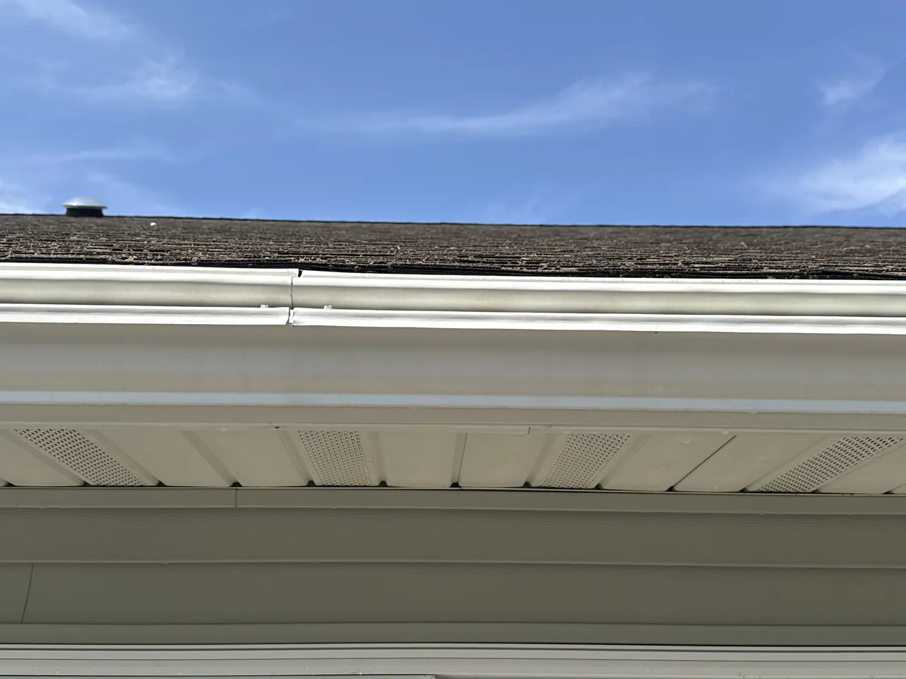 White gutter exterior and soffit after cleaning by River City Pressure Washing